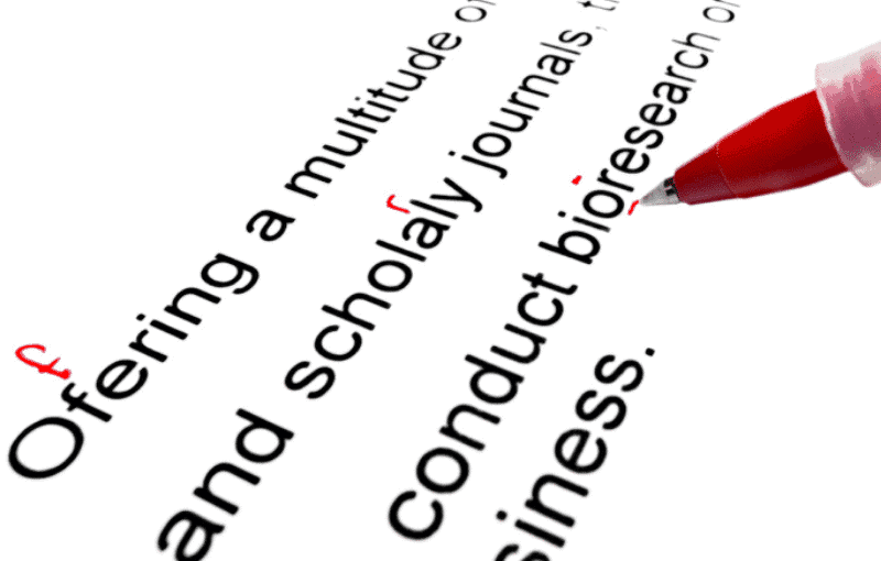 Red pen marking spelling errors in text Red pen marking spelling errors in text